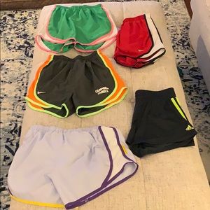 Lot of 5 running shorts. 4 Nike, 1 Adidas.